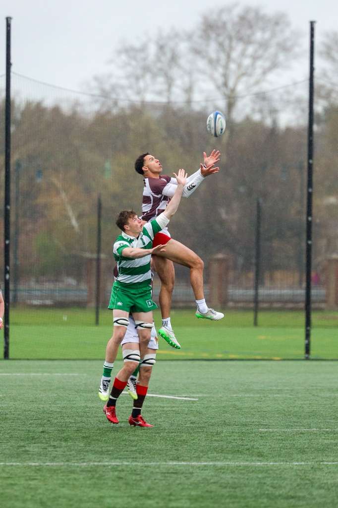 Marco Lapierre '28 wins a ball in the air against Dartmouth