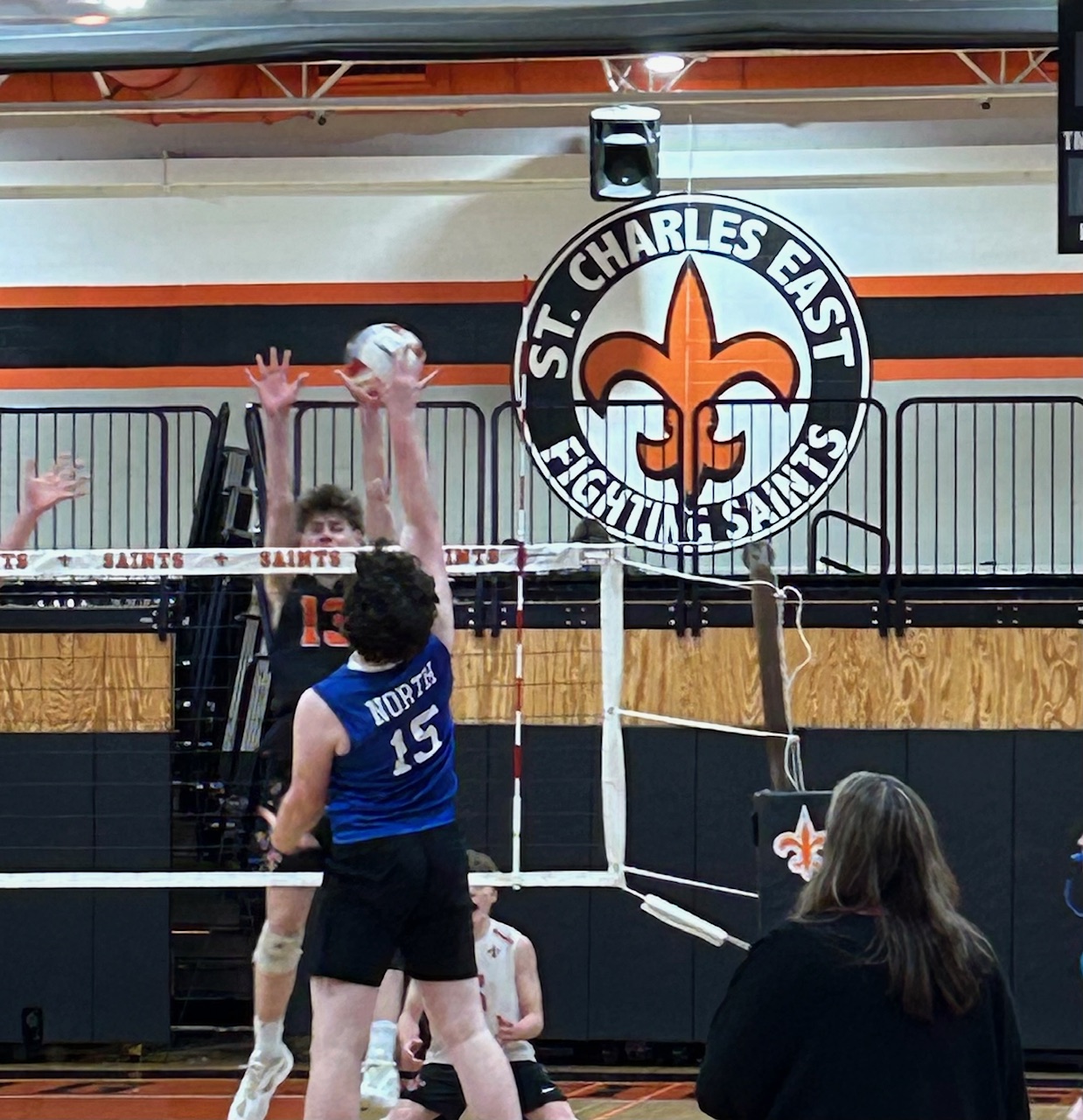 Fighting Saints rally past St. Charles North in three-set conference win