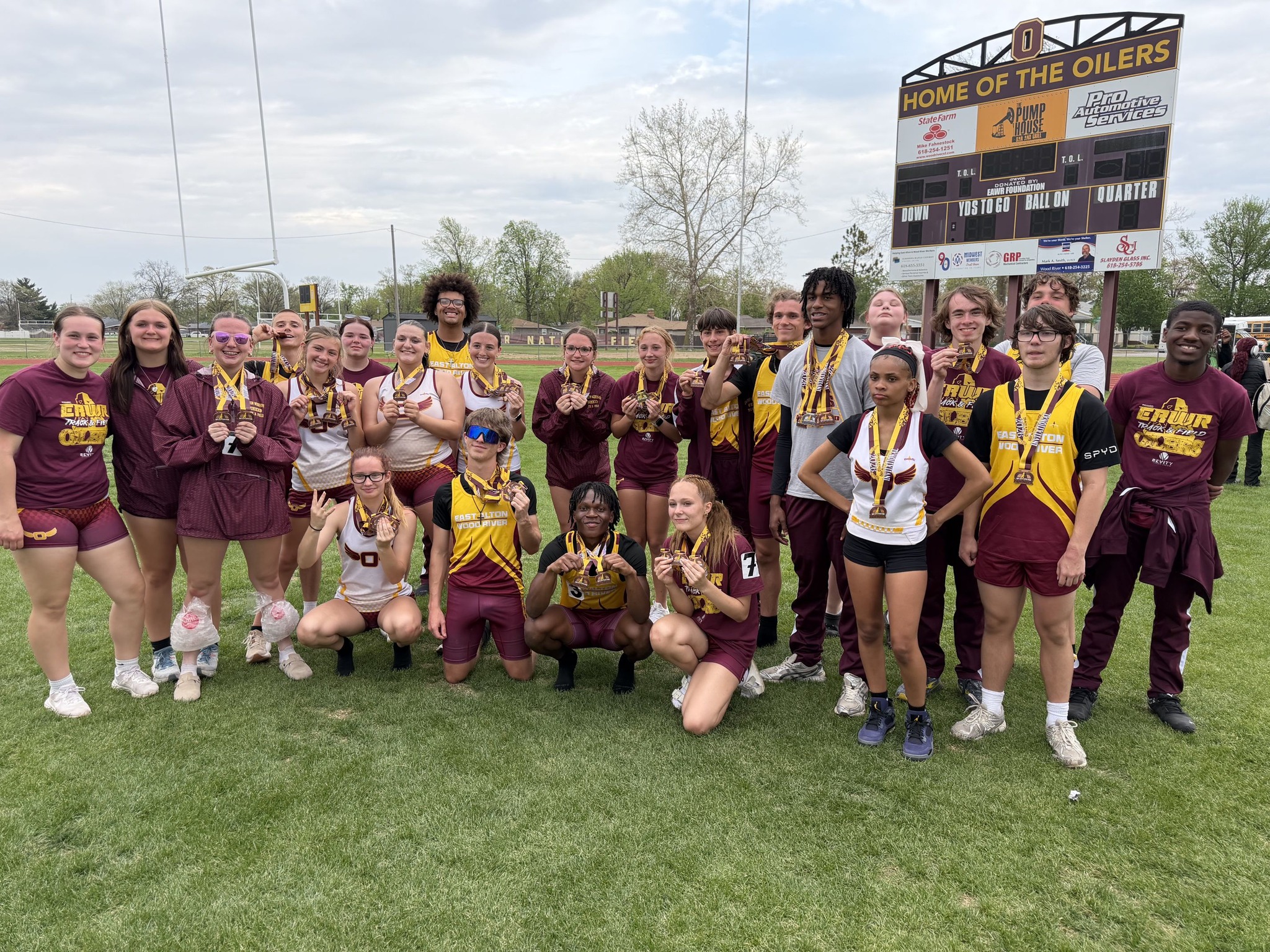 The Oilers pose for a photo with all their medals