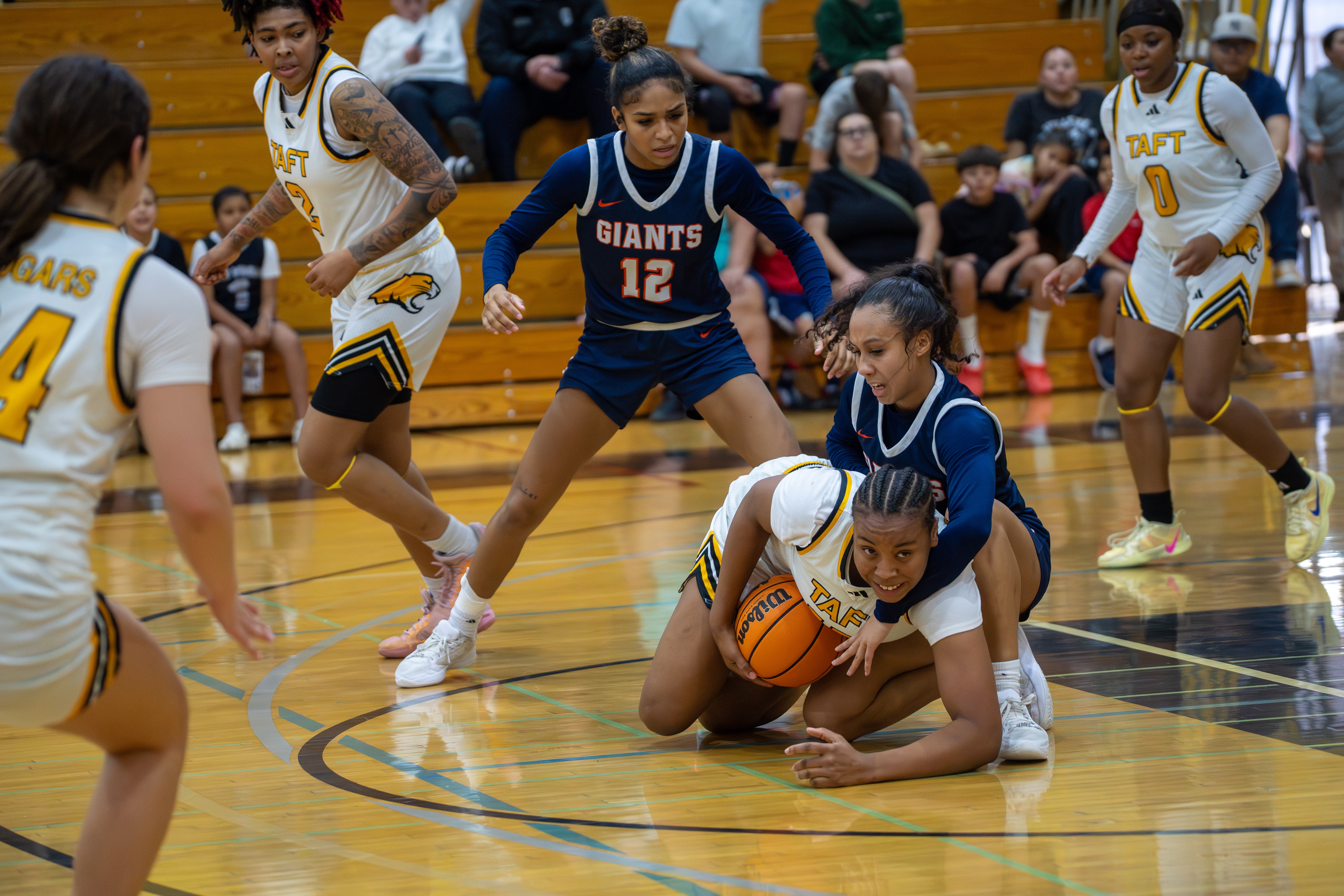 Photo by Rachel Sasi. Pictured is Alesha Gordon fighting for a loose ball.