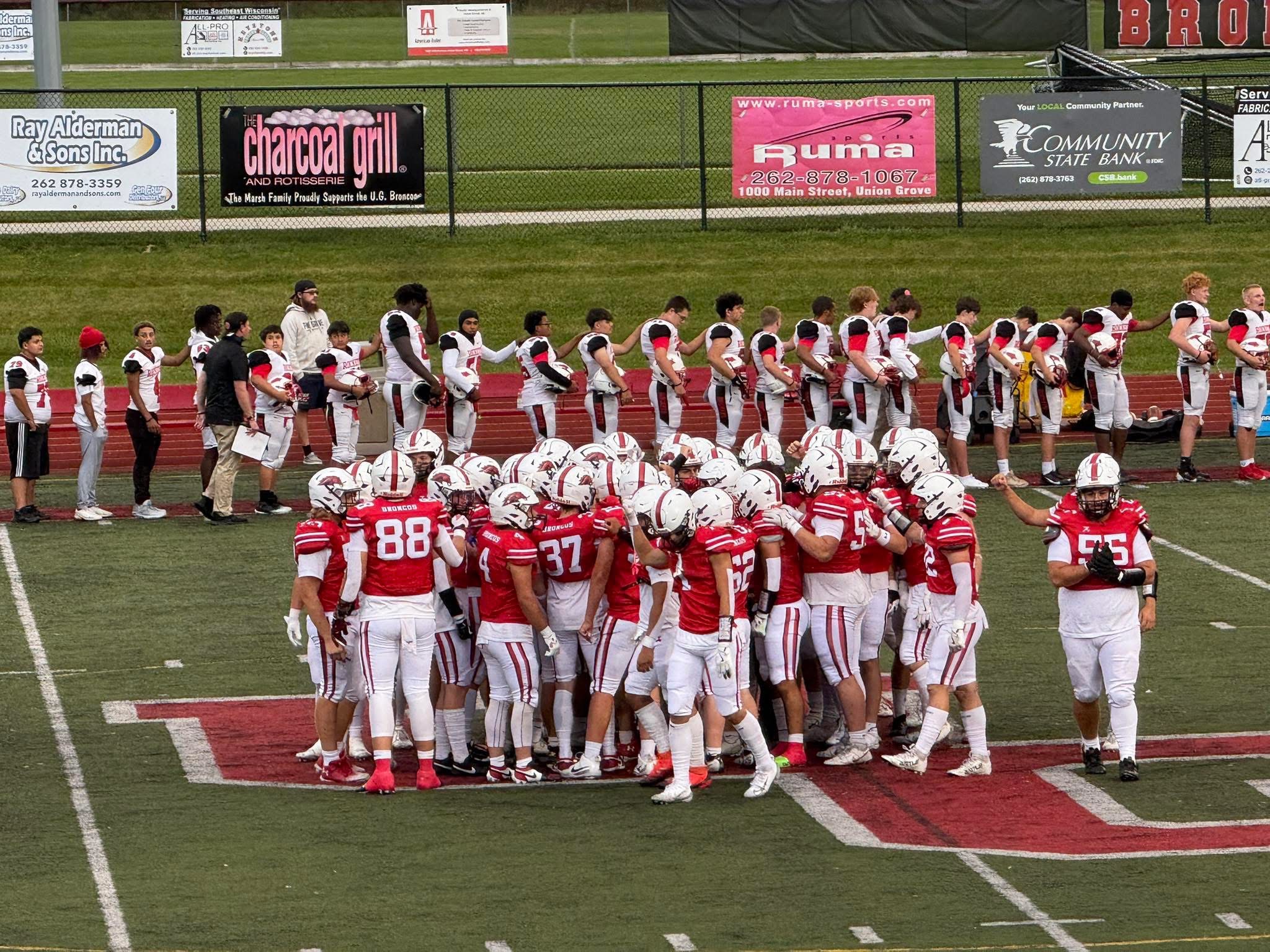 Union Grove Broncos Triumph in Rainy Football Battle Against South Milwaukee Rockets